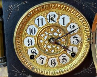 "Star", an antique mantel clock manufactured by W.M.L. Gilbert that measures, 10.75” H x 15.75” W x 7.25” D. Comes with key and pendulum in working condition.

