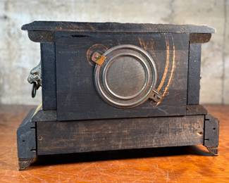 "Star", an antique mantel clock manufactured by W.M.L. Gilbert that measures, 10.75” H x 15.75” W x 7.25” D. Comes with key and pendulum in working condition.

