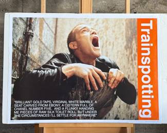 This lot features a Trainspotting movie poster that measures, 25” H x 35” W.

