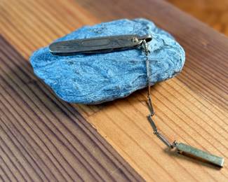 This lot features a vintage N.C. Co. two-blade pocket knife, potentially a fruit or gentleman’s knife, with a gold-filled engraved handle. 

