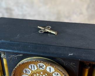 "Star", an antique mantel clock manufactured by W.M.L. Gilbert that measures, 10.75” H x 15.75” W x 7.25” D. Comes with key and pendulum in working condition.

