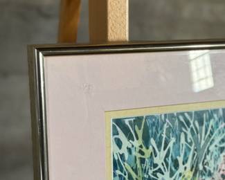 This lot features an original watercolor landscape painting by listed Oregon artist, Nancy Vittone. This piece measures in frame, 19.5” H x 26.75” W. Nancy Vittone (later Nancy Ericksen-Ward) was an artist and community figure in the Salem, Oregon area, known for her involvement with local art projects, like helping organize murals for the Keizer Iris Festival, and being associated with Oregon State University (OSU) through her husband, artist John Ericksen, though she wasn’t the primary artist featured in the search snippets, she was connected to the local art scene in the late 20th/early 21st century in Salem/Keizer. 

