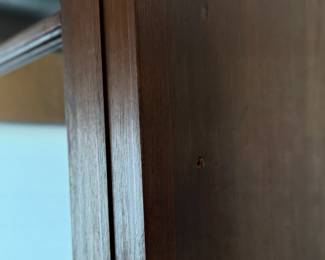 This lot features a large, solid wood cabinet with glass pane doors that measures, 84” H x 52” W x 13.5” D. This cabinet comes locked (no key) and without shelves.

