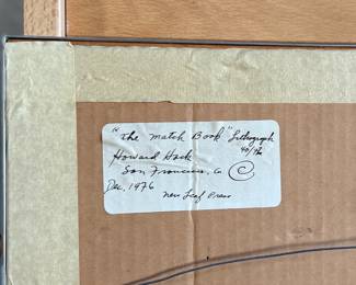 “The Match Book”, a limited edition lithograph by listed artist, Howard Hack. Edition 40/72, pencil signed circa 1972 and measures in frame, 30” H x 22” W. Howard Edwin Hack (July 6, 1932 – June 11, 2015) was an American representational painter and graphic artist, with works in numerous museum collections. Known for an innovative approach to a variety of media, as well as use of traditional oil paints, Hack began working in the late 1940s.

