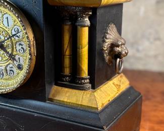 "Star", an antique mantel clock manufactured by W.M.L. Gilbert that measures, 10.75” H x 15.75” W x 7.25” D. Comes with key and pendulum in working condition.

