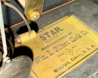 "Star", an antique mantel clock manufactured by W.M.L. Gilbert that measures, 10.75” H x 15.75” W x 7.25” D. Comes with key and pendulum in working condition.

