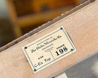 This lot features a stacking barrister bookcase manufactured by Globe Wernicke, dating back to the early 1900s. This bookcase in particular has a total of seven (7) pieces – 5 stacking bookcases, a base, and a topper. This piece measures from top to bottom, 79” H x 34” W x 11.5” D.

