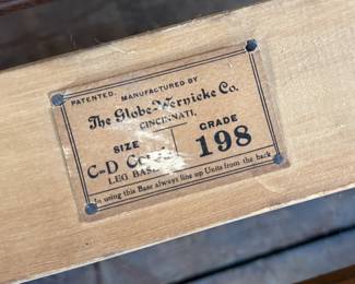 This lot features a stacking barrister bookcase manufactured by Globe Wernicke, dating back to the early 1900s. This bookcase in particular has a total of seven (7) pieces – 5 stacking bookcases, a base, and a topper. This piece measures from top to bottom, 79” H x 34” W x 11.5” D.

