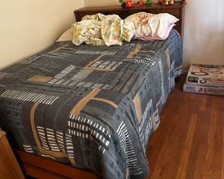 Bed frame with headboard, footboard, matress, and matching comforter set (with pillow shams, not shown).