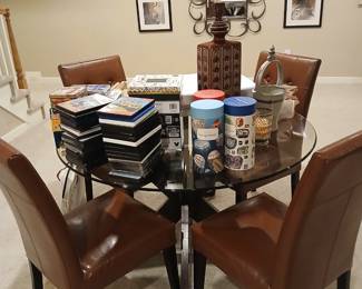Game table, $595                                                                                      4 leather chairs- $145 ea. 2 min.