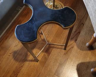 Club shaped black and burnished bras bass end table, brass floor lamp