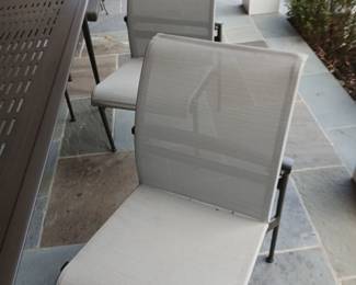 brown jordan patio dining table, 6 wheat colored side chairs, black frames