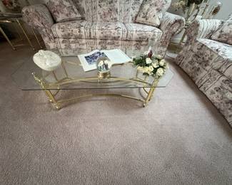 . . . glass coffee table on brass base