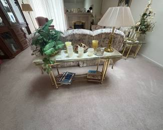 . . . glass sofa table on brass base