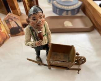 Antique metal man with wheel borrow 