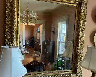 Heavily carved antique mirror