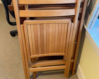 Two wood folding chairs