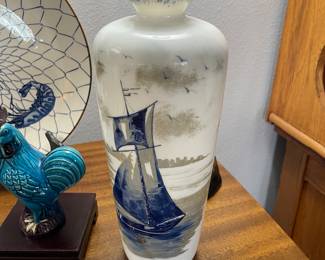 Vintage blue and white opaline glass vase with a Dutch scene. 