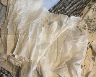 Child’s antique shoes and clothing