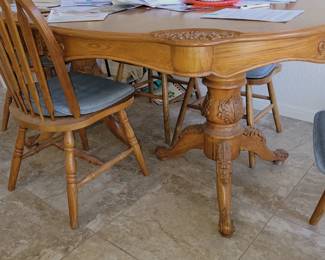 Carved dining table with 6 chairs