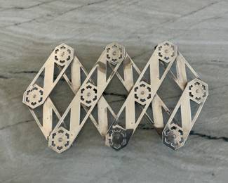 Early 20th century Trivet (expandable) for hot dishes.