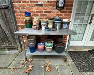 Assorted Ceramic and Metal Planters, Watering Cans, and Metal Potting Bench 