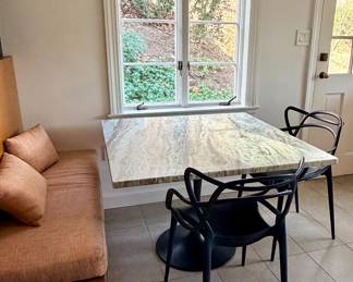 Kartell “Masters” chairs and Marble Top Table.