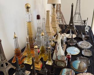 Collection of vintage Eiffel towers and other French tourist memorabilia