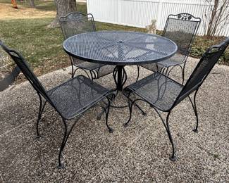 Woodard (?) iron patio table with four chairs.                                               BUY IT NOW $125.00  Call Jan at 314-960-5700  to purchase.  21 1/2 diameter.  