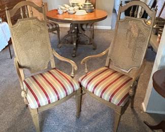 Thomasville dining table, with six  cane back chairs (two are arm chairs) and two (12 inch) leaves.                                                                        $195.00 BUY IT NOW! Call Jan at 314-960-5700 to purchase.  China in background is no longer available for sale.