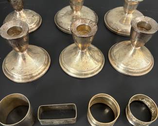 Sterling candlesticks and napkin rings