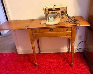 Vintage 1950 401A  all metal Singer sewing machine in maple cabinet/sewing table
