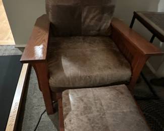 Cushioned wooden armchair with footstool 