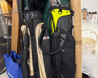 Two sets of right handed golf clubs.
