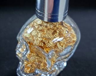 24K Yellow Gold Flakes In Skull Shaped Glass Bottle