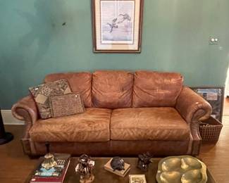large leather sofa, long wooden coffee table