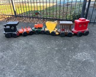 Vintage wooden toy train set by Exceptional Line Co. Each car is approximately 8-10 inches long.