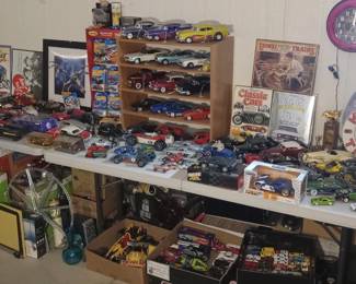 many 100s of toy cars, hot wheels, matchbox, johnny lightning & many other brands & scales, also planes, tanks, figures and 100s of other toys & games. 