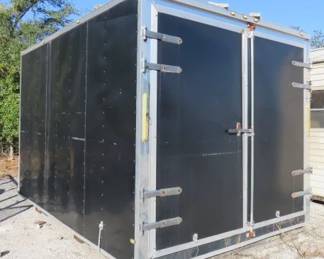 Black enclosed aluminum cargo trailer