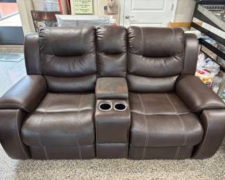 Faux Brown Leather Loveseat recliner w pulls $300.00   74”L 36”d 41”t slight wear on center arm rest/storage.