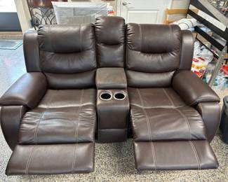 Faux Brown Leather Loveseat recliner w pulls $300.00   74”L 36”d 41”t slight wear on center arm rest/storage.