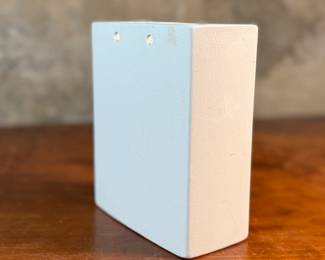 This lot features a vintage Napco Lady Head Vase (or wall pocket) from around 1958. These items were manufactured in Japan by the National Potteries Corporation (Napco) and were popular home decor items in the 1950s and 1960s. This vase measures, 6.5” H x 5.25” W x 2.75” D and is in very good condition.

