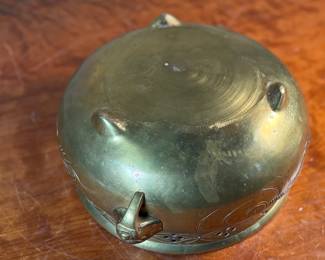 This lot features a large Mottahedeh brass bowl/planter with lion-design handles and clawed feet that measures, 5.75” H x 14” W x 11” D.

