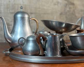 This lot features a pewter coffee & tea service set with various items manufactured by Stede, Stieff, & Royal Holland Pewter.

