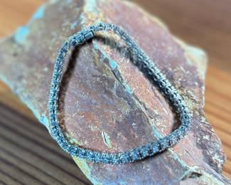 This lot features a genuine diamond tennis bracelet, set in sterling silver and features forty-eight (48) diamonds. The bracelet measures, 7.5” and has a total approx. weight of 11.44 grams.

