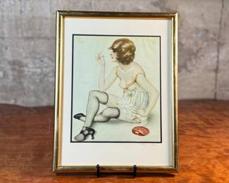 "Smoke Dreams", a hand-signed lithograph by listed artist, Alberto Vargas. Professionally framed and measures in frame, 12.75” H x 9.75” W. Vargas was a prominent 20th-century illustrator known for his sensual pin-up girl paintings that appeared in magazines like Esquire and Playboy. "Smoke Dreams" is one of the artist’s favorite works from the 1920s.

