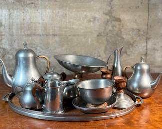 This lot features a pewter coffee & tea service set with various items manufactured by Stede, Stieff, & Royal Holland Pewter.

