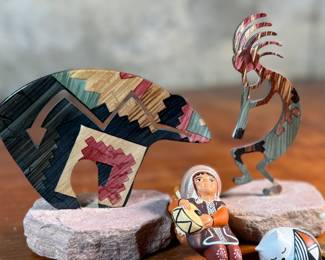 This lot features a curated collection of Native American items including sculptures, Acoma potttery, and more.

