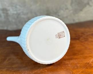 This lot features a vintage Ernest Sohn Creations "Doric" line white ribbed ceramic coffee server or teapot. It was designed by Ernest Sohn and produced by Hall China in the 1950s. This model typically holds around 10 to 12 cups of coffee or tea and measures, 12” H x 10” W x 6” D.

