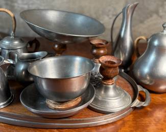 This lot features a pewter coffee & tea service set with various items manufactured by Stede, Stieff, & Royal Holland Pewter.


